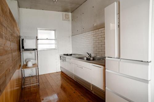 Kuchyň nebo kuchyňský kout v ubytování peacefree ocean miyara - Vacation STAY 01811v