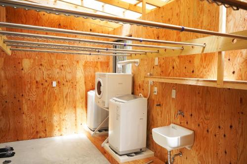 a bathroom with two toilets and a sink at Etcetera Niijima Nagisa Building - Vacation STAY 41900v in Niijimamura