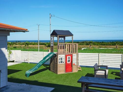 a small playground with a slide and a slideintend at VOGUE C, a private inn with a panoramic view of th - Vacation STAY 14693v in Isumi