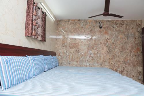 Postel nebo postele na pokoji v ubytování Hotel Temple View
