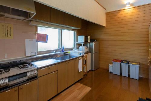 a kitchen with a sink and a counter top at Kabato County - Camp - Vacation STAY 42252v in Shintotsukawa