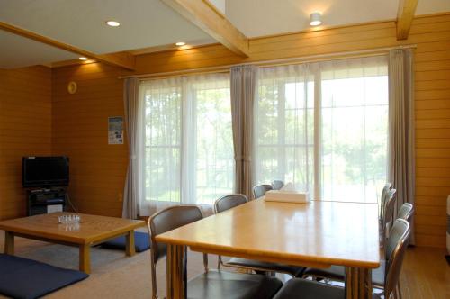 a dining room with a table and chairs at Kabato County - Camp - Vacation STAY 42252v in Shintotsukawa