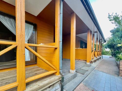 a facade of a house with wooden windows at Yoronto - Vacation STAY 18850v in Yoron