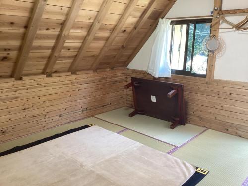 an inside view of a room with wood paneling at Nakano-san Chi Campsite & RV Park Hotaru no Sato- Camp - Vacation STAY 42210v in Higashi-shibuta