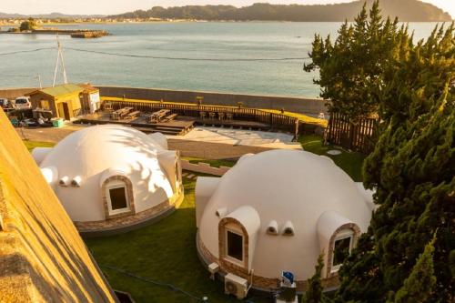 an overhead view of two domed buildings with the water at Cam Cam Dome House & SAUNA - Vacation STAY 42283v in Minamiboso