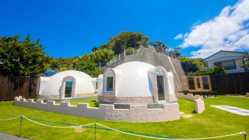 a house shaped like a church in a yard at Cam Cam Dome House & SAUNA - Vacation STAY 42283v in Minamiboso