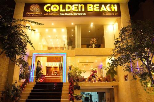 a building with a staircase leading to a door at Khách sạn Golden Beach Nha Trang in Nha Trang