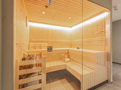 a sauna with a tub and a staircase at Chalet in Niedernsill near Ski Slopes in Niedernsill