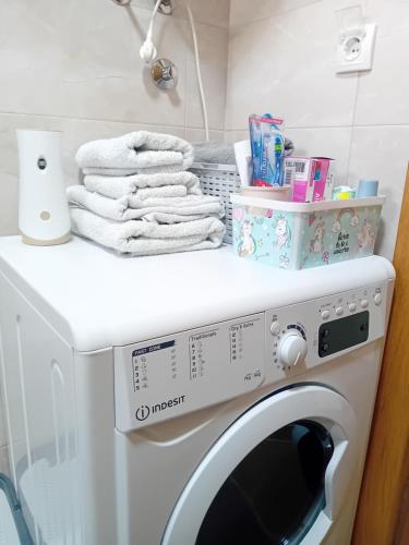 a washing machine with towels on top of it at Aura Trebinje 2 in Trebinje