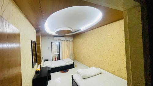 Postel nebo postele na pokoji v ubytování Hotel 71 INN