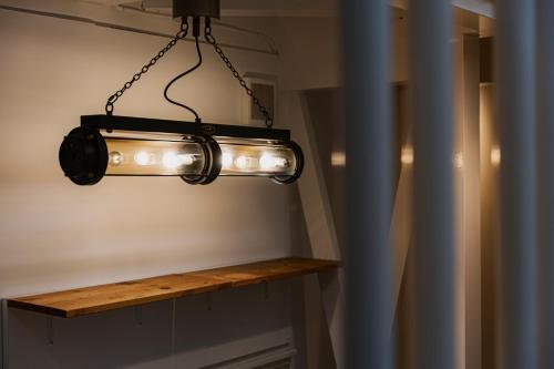 a light that is hanging from a ceiling at 博多の旅籠 すノや in Fukuoka