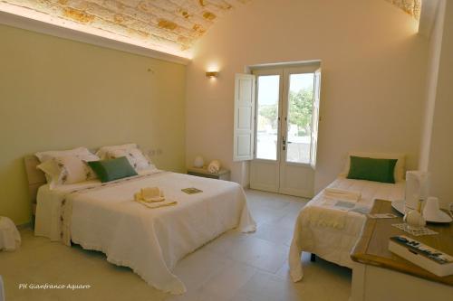 Postel nebo postele na pokoji v ubytování Villa Itriò - In the heart of Apulia - B&B - pool - rural experience