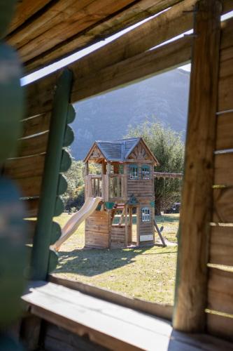 a view of a playground through a window at The Grampians Motel in Halls Gap