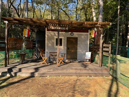 a small shed with a table and chairs on a wooden deck at Biwako Hills - Vacation STAY 27844v in Takashima