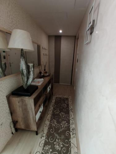 a room with a bed and a table with a lamp at villa relax in Riva del Garda