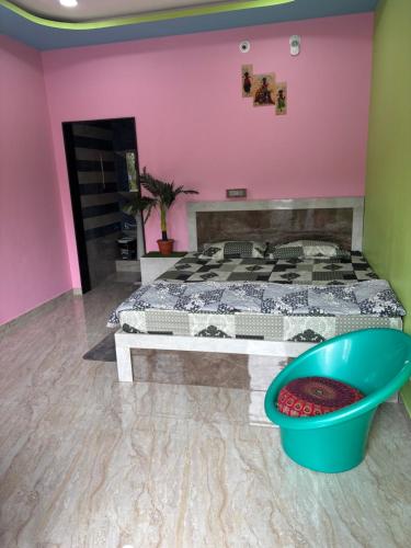 a bedroom with a bed and a bath tub at Aras homestay hampi in New Hampi