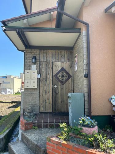 a wooden door on the side of a house at Classy Busshozan - Vacation STAY 15858 in Takamatsu