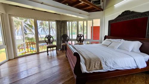 Ένα ή περισσότερα κρεβάτια σε δωμάτιο στο Cheshire Village - Beach Resort