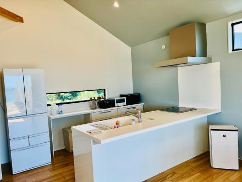 a kitchen with a sink and a counter top at BHOLIC - Vacation STAY 15876 in Shimonoseki
