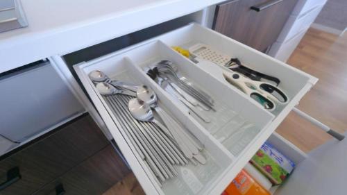 a white drawer with scissors and other kitchen utensils at Padel Okinawa Villa - Vacation STAY 32469v in Uruma