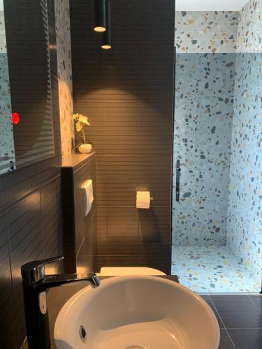 a bathroom with a bath tub and a toilet at Room with Balcony and Sea View in Zadar