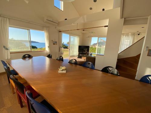 a conference room with a large wooden table and chairs at white house - Vacation STAY 60636v in Shimonoseki