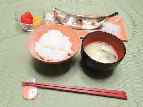 a table with two bowls of rice and chopsticks at Hagi no Oyado Hananari no Niwa - Vacation STAY 16121 in Hagi