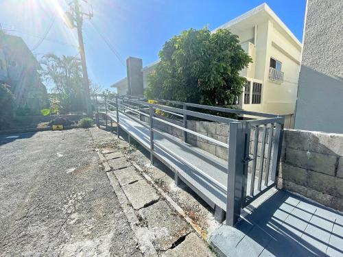 a metal gate on the side of a street at Second floor - Vacation STAY 16317 in Ginowan