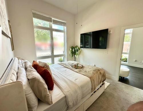 En eller flere senge i et værelse på The Glass Loft Midtown