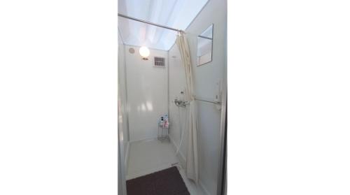 a bathroom with a shower with a glass door at Ashigarakami-gun - Camp - Vacation STAY 84740v in Hokizawa