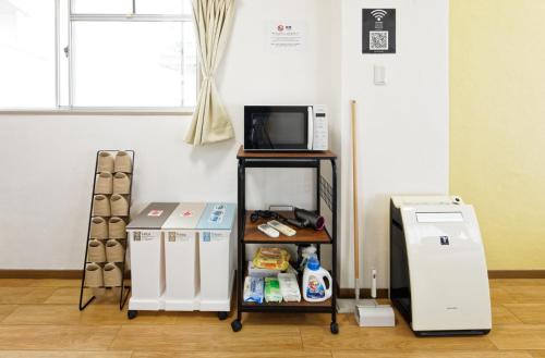 a room with two refrigerators and a microwave at Kurokawa Building No, 201 - Vacation STAY 16198 in Nagoya