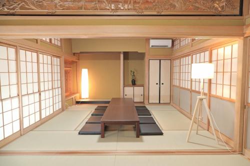 a large room with a table and windows at Utage HANARE - Vacation STAY 93680v in Kainan