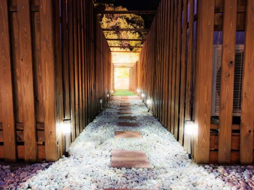 a hallway of a building filled with rocks at Riverside Glamping Kamiseno - Vacation STAY 92767v in Hiroshima
