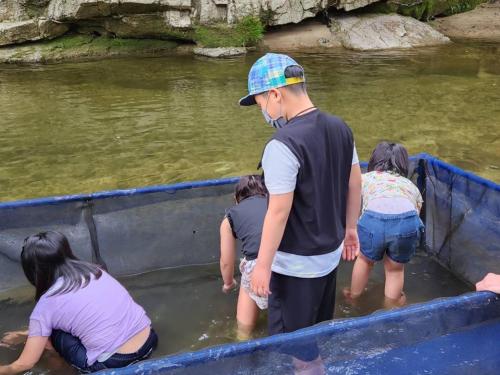 a group of people in a boat in the water at Riverside Glamping Kamiseno - Vacation STAY 92767v in Hiroshima