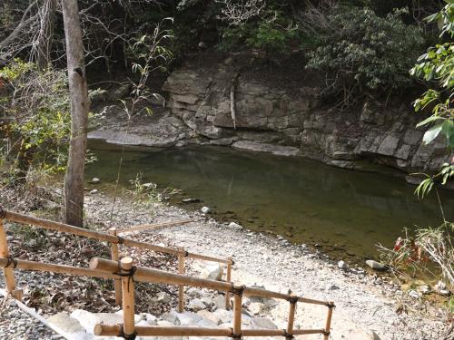 a small pool of water with a wooden fence at Riverside Glamping Kamiseno - Vacation STAY 92767v in Hiroshima