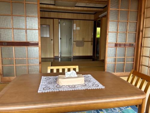 a wooden table with a box on top of it at Yoshino Nagaya - Vacation STAY 16227 in Kami-ichi