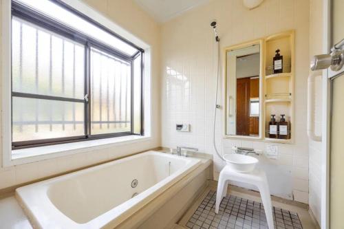 a bathroom with a tub and a sink and a window at Itoshima - House - Vacation STAY 16267 in Itoshima