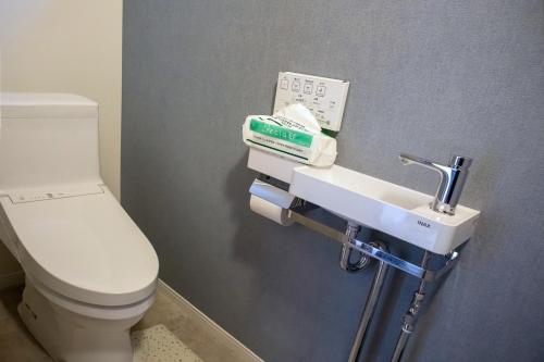 a bathroom with a toilet and a sink at Tomoeyado - Vacation STAY 05898v in Shimada