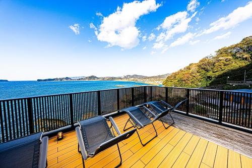 a deck with two chairs and a view of the water at The View Minamiboso - Vacation STAY 16265 in Minamiboso