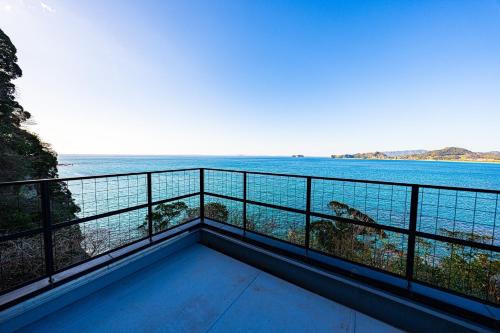 a balcony with a view of the ocean at The View Minamiboso - Vacation STAY 16265 in Minamiboso
