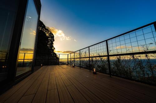 a balcony of a building with a view of the ocean at The View Minamiboso - Vacation STAY 16265 in Minamiboso