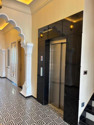 a hallway with a elevator in a building at Chokha Dhaba in Mahwah