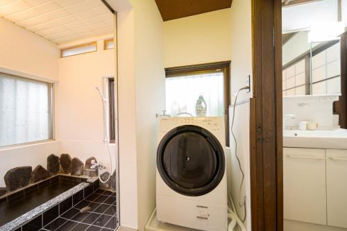 a laundry room with a washer and dryer at Yufu no Yu Raku - Vacation STAY 18768v in Yufuin