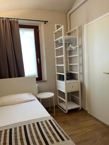 a bedroom with a bed and a book shelf at Abbazia Bed & Breakfast, MantegnaHotels in Mantova