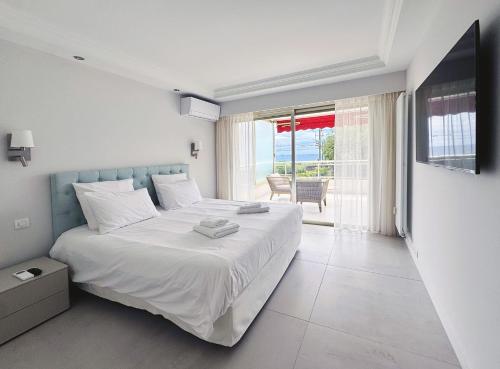 Ένα ή περισσότερα κρεβάτια σε δωμάτιο στο Elegant 2 Br with parking