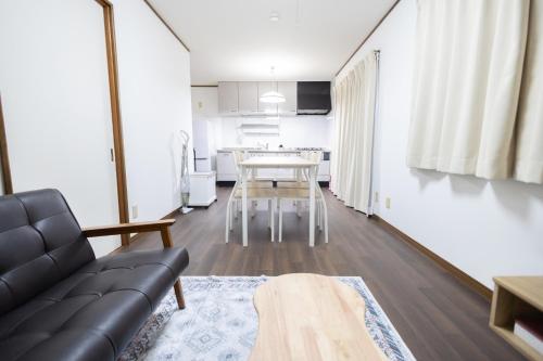a living room with a couch and a table at Tokorozawa - House - Vacation STAY 16364 in Tokorozawa