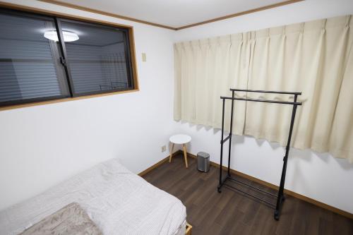 a bedroom with a bed and a window at Tokorozawa - House - Vacation STAY 16364 in Tokorozawa