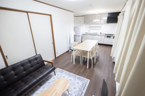 a living room with a couch and a table at Tokorozawa - House - Vacation STAY 16364 in Tokorozawa