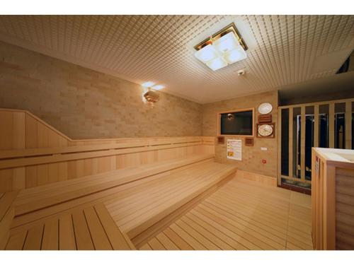 a large empty room with wood floors and a television at OCEAN FRONT TATEYAMA - Vacation STAY 61331v in Tateyama