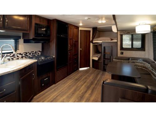 an rv kitchen with wooden cabinets and a sink at OCEAN FRONT TATEYAMA - Vacation STAY 61331v in Tateyama
